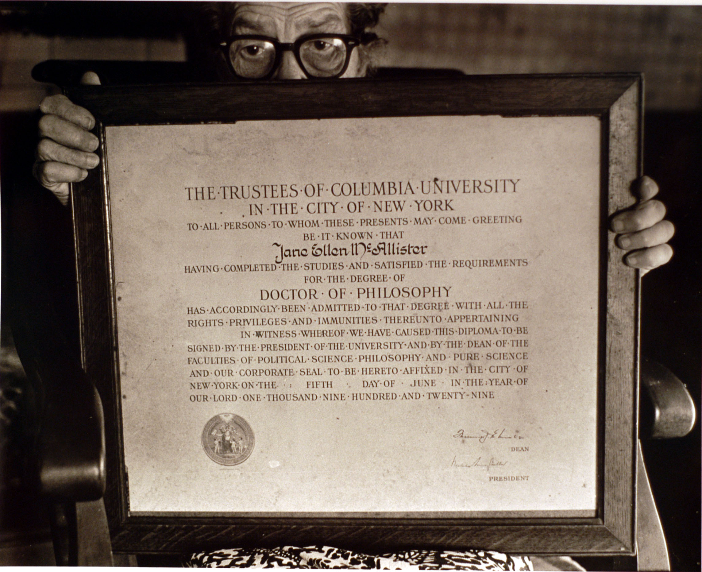 Holding her diploma from Columbia University